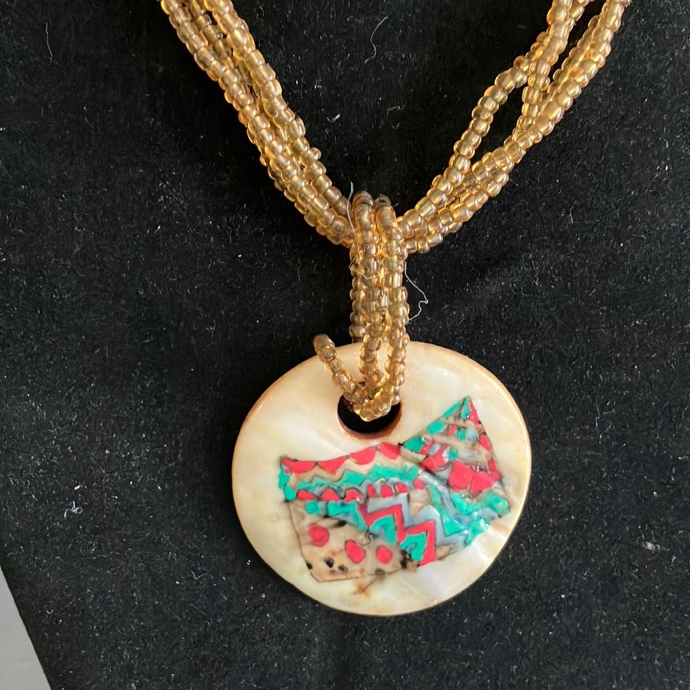 Gold and Green Necklace with Intricate Pendant Design